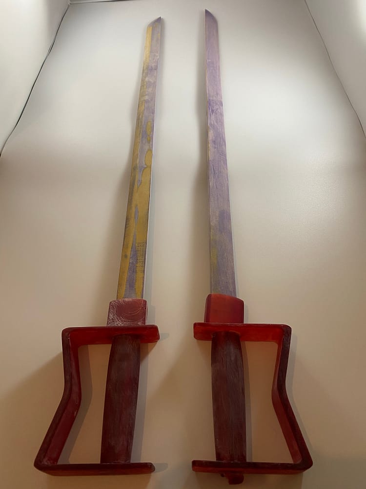 Prototype I & II of General Olivier Armstrong's sword, half completed. Next to each other.