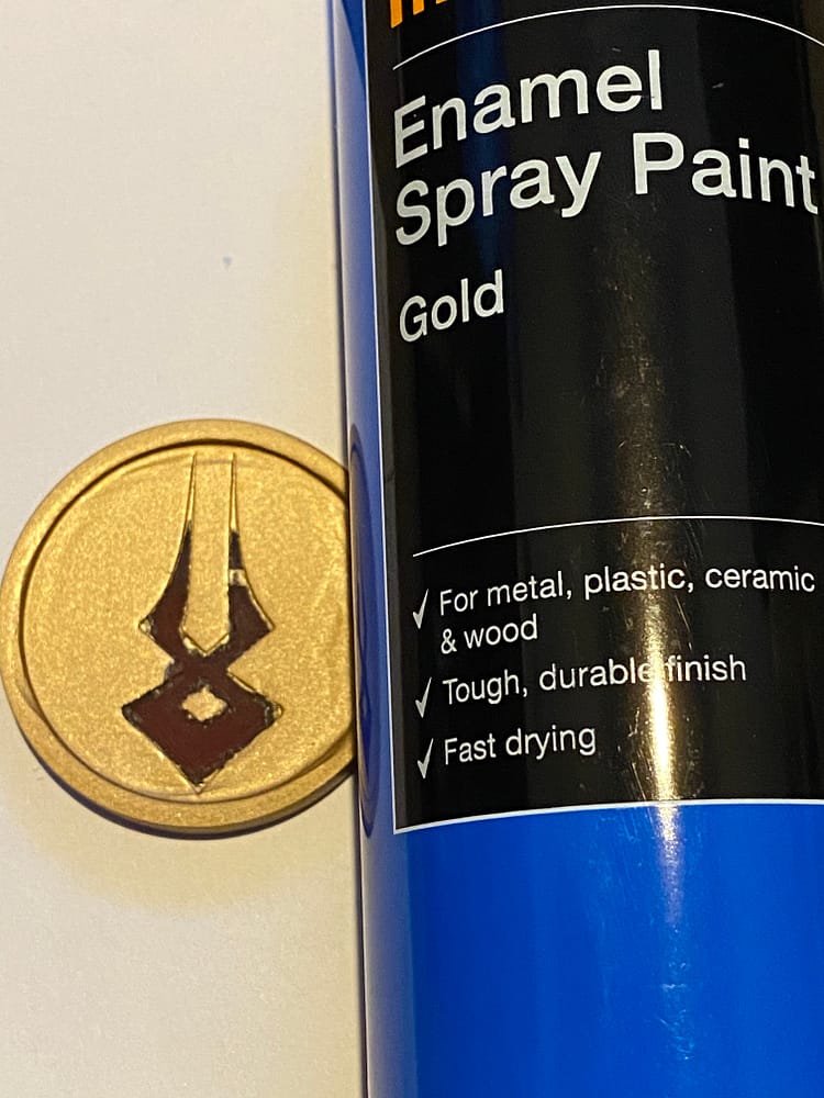 Finished Charon's Obol next to the gold enamel spraypaint.