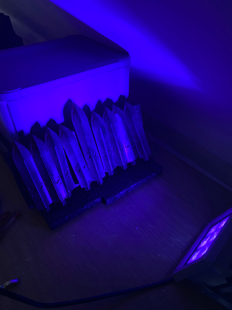 The spikes curing under a UV Blacklight.