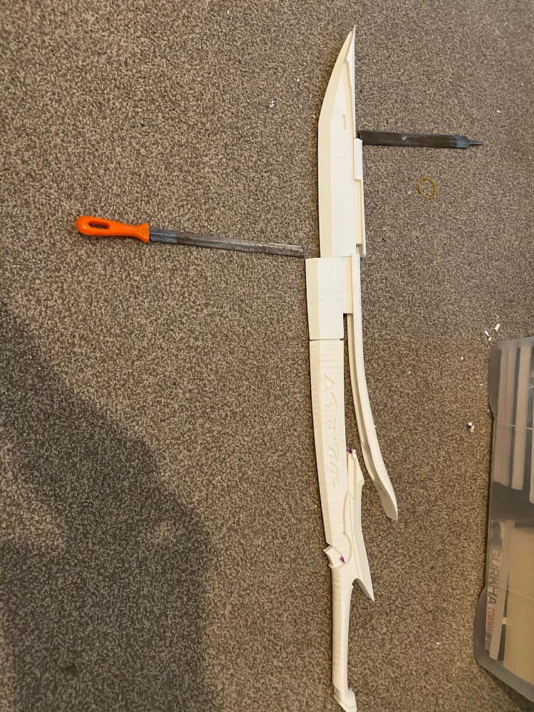 Handle, base of blade and both parts of the spine completed.