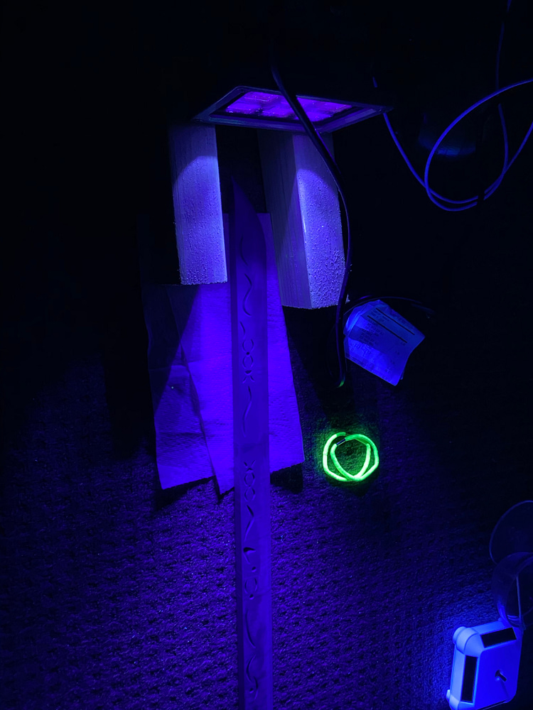UV resin curing under a blacklight.