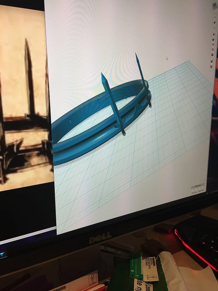 Workspace of Autodesk 123 with the circlet and a single sword next to the reference image of a drawn crown.