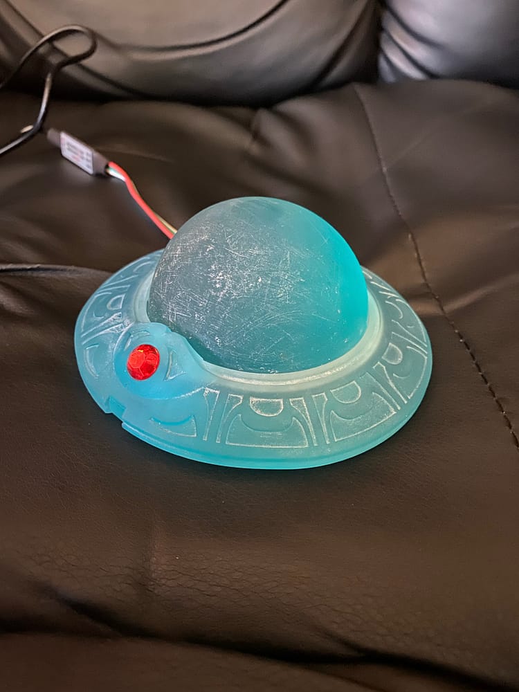 Unifnished blue model of the FFX Memory Sphere with a red gem.
