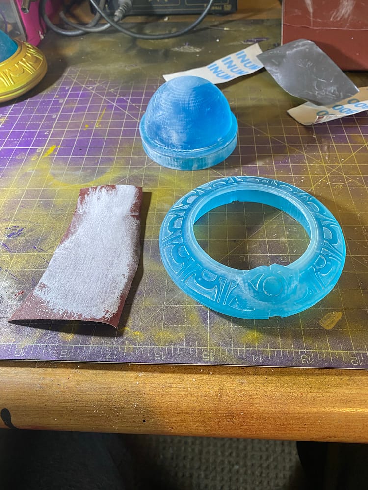 Sandpaper, the ring, dome and base.