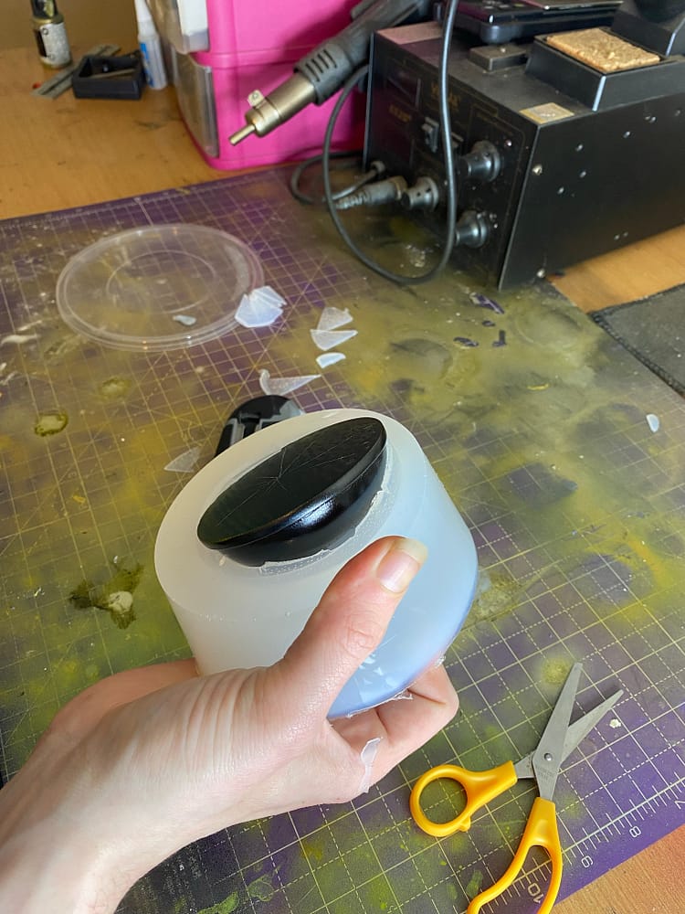 Dome being removed from silicone mold (mould?)