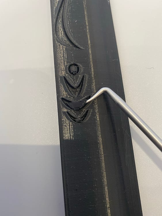 Support removal from the engravings on General Armstrongs sword
